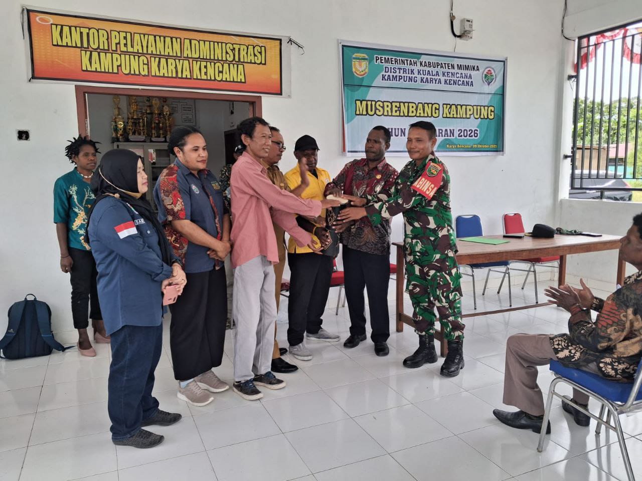Dukung Program Pemerataan Pembangunan, Babinsa Koramil 1710-03/Kuala Kencana Hadiri Musrenbang Tingkat Kampung TA 2026