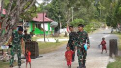 Senyum Anak-Anak Warnai Hasil Pembangunan Jalan Cor 250 Meter TMMD Ke-129 di Kampung Sesor